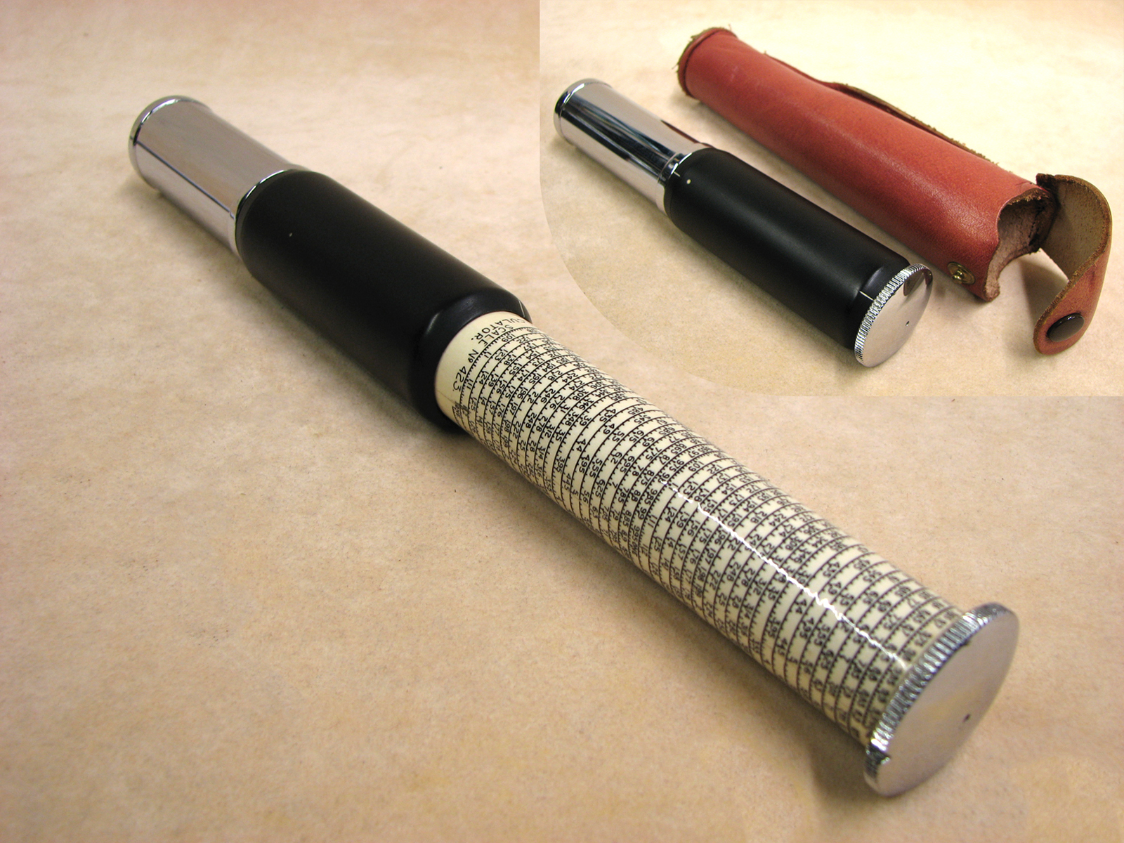 Early 1970's Otis King Model K type C leather cased cylindrical slide rule calculator